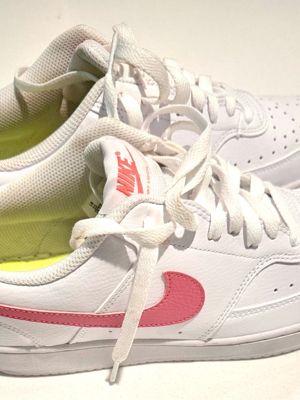 Nike Women's Air force 1 Leather Sneakers with Pink Swoosh Accent